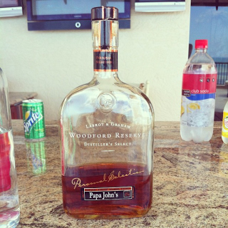 Illustration for article titled Here's A Special Bottle Of Woodford Reserve With Papa John's Name On It